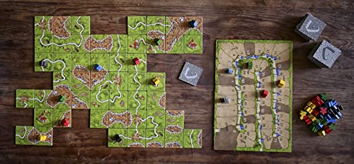 Componentes del juego de mesa Carcassonne, losetas, meeples y caja incluidos