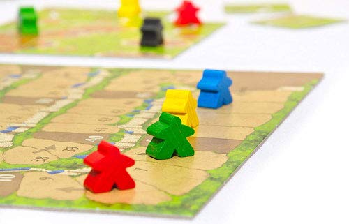Meeples de colores del juego de mesa Carcassonne